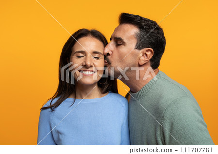 Portrait of happy old caucasian husband kiss in chick wife, enjoy free time Portrait of happy old caucasian husband kiss in chick wife, enjoy free time 111707781