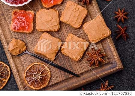Delicious nutritious sandwiches with peanut butter, strawberry jam Delicious nutritious sandwiches with peanut butter, strawberry jam 111707823