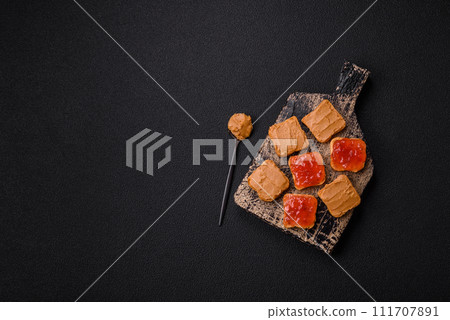 Delicious nutritious sandwiches with peanut butter, strawberry jam Delicious nutritious sandwiches with peanut butter, strawberry jam 111707891