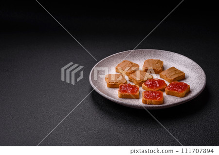 Delicious nutritious sandwiches with peanut butter, strawberry jam 111707894