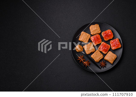 Delicious nutritious sandwiches with peanut butter, strawberry jam 111707910