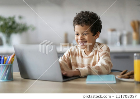 Distance Learning. Smiling Preteen Black Boy Study With Laptop At Home 111708057