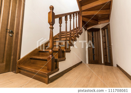 Modern brown oak wooden stairs and doors in new renovated house interior 111708081