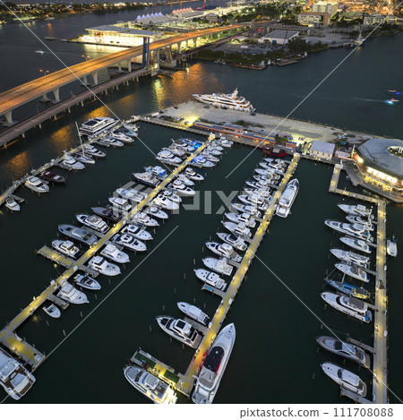 Miami Brickell bay harbor with many luxury yachts and sailboats. Docking place for water transport in Florida, USA Miami Brickell bay harbor with many luxury yachts and sailboats. Docking place for water transport in Florida, USA 111708088