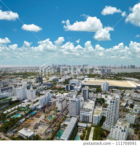 Miami Beach city in southern Florida, USA. High luxury hotels and condominium buildings. High angle view of tourist infrastructure in United States Miami Beach city in southern Florida, USA. High luxury hotels and condominium buildings. High angle view of tourist infrastructure in United States 111708091