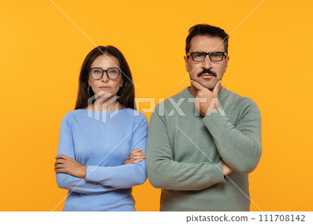 Pensive, serious, smart senior caucasian couple in casual and glasses think 111708142