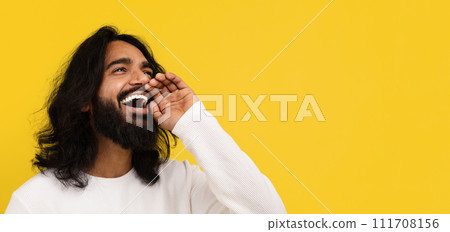 Positive stylish young indian guy make announcement, blank space Positive stylish young indian guy make announcement, blank space 111708156