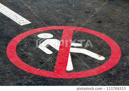 End of walk way sign on the asphalt road surface End of walk way sign on the asphalt road surface 111708315