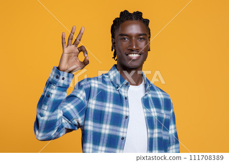Portrait Of Positive Young Black Guy Showing Ok Gesture At Camera Portrait Of Positive Young Black Guy Showing Ok Gesture At Camera 111708389