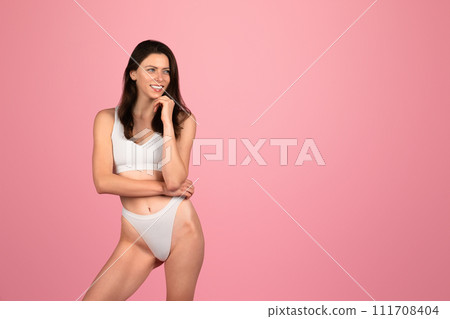 Pensive millennial caucasian woman in white underwear smiling enjoy spare time, body care 111708404