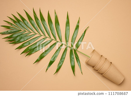Paper cups on a beige background, top view Paper cups on a beige background, top view 111708687