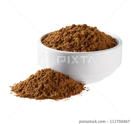 cinnamon powder spilled out of a ceramic bowl isolated on a white background. cinnamon powder spilled out of a ceramic bowl isolated on a white background. 111708867