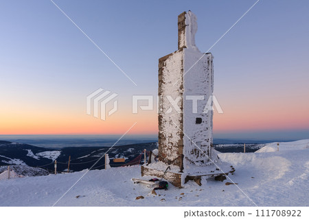 Stone column with height quota 1603 m in snezka, mountain on the border between Czech Republic and Poland, winter, sunrise time. 111708922