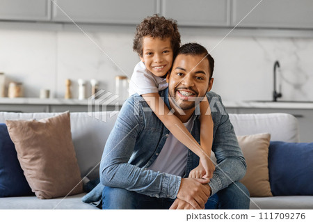 Father Son Love. Happy Black Man And Preteen Son Hugging At Home 111709276