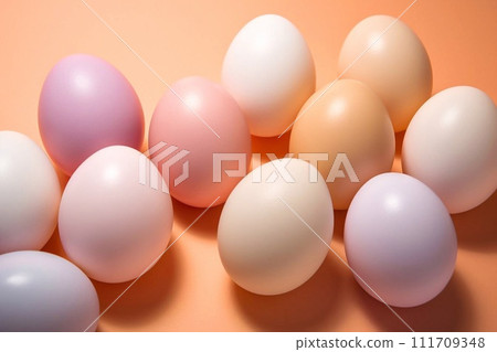 White and pink eggs on an orange background. 111709348