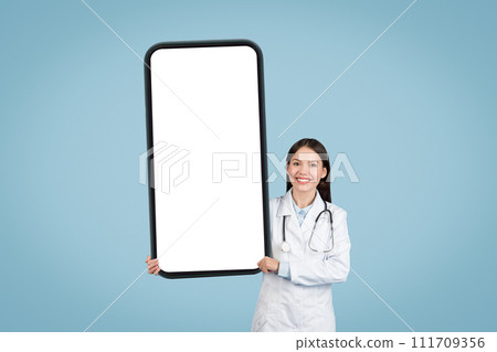 Woman doctor with blank mobile screen, mockup Woman doctor with blank mobile screen, mockup 111709356