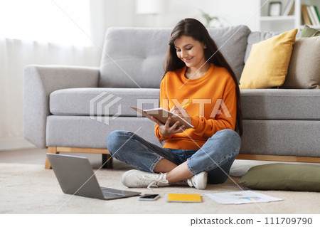 Young indian woman employee have online training, home interior Young indian woman employee have online training, home interior 111709790