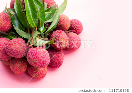 Lychee fruit on pink background. Lychee fruit on pink background. 111710158