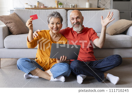 Easy Payments. Portrait Of Senior Couple With Laptop And Credit Card Easy Payments. Portrait Of Senior Couple With Laptop And Credit Card 111710245