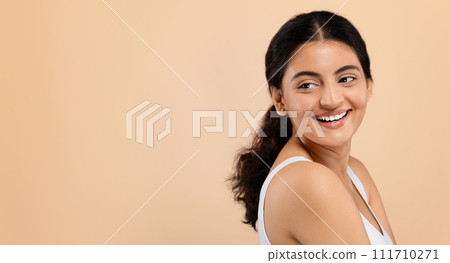 Beauty Ad. Smiling Indian Woman Looking At Copy Space Behind Her Back Beauty Ad. Smiling Indian Woman Looking At Copy Space Behind Her Back 111710271
