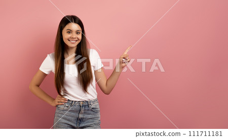 Check This. Happy Teen Girl Pointing Aside At Copy Space With Finger 111711181