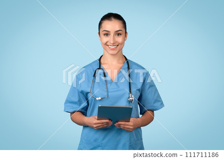 Cheerful female medical professional with tablet Cheerful female medical professional with tablet 111711186
