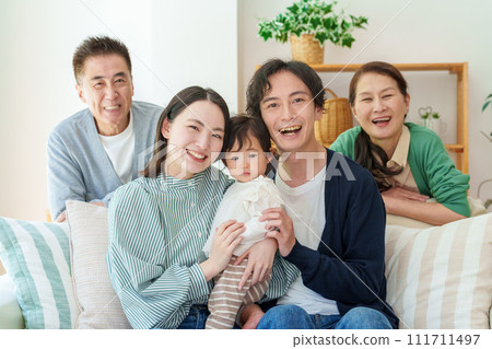 Three generation family: couple, grandparents, baby 111711497