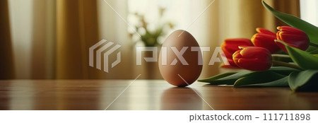 Table with tulips, colorful Easter eggs. Eggs and tulips on kitchen table near window. Happy Easter greeting card, banner, festive background. Blurred background. Copy space. 111711898