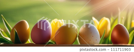 Table with tulips, colorful Easter eggs. Eggs and tulips on kitchen table near window. Happy Easter greeting card, banner, festive background. Blurred background. Copy space. 111711903