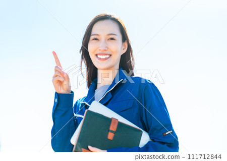 Young woman working in a distribution center posing Young woman working in a distribution center posing 111712844