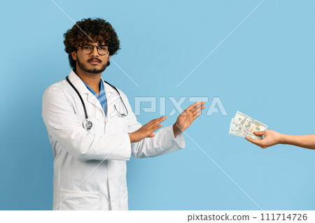 Annoyed angry doctor refusing to take bribe Annoyed angry doctor refusing to take bribe 111714726