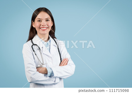Smiling caucasian female doctor with arms crossed Smiling caucasian female doctor with arms crossed 111715098