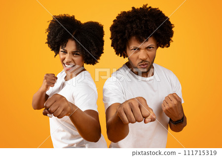 Young african american couple showing fists on background 111715319