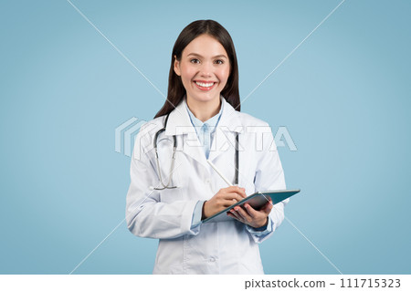 Cheerful female doctor holding digital tablet Cheerful female doctor holding digital tablet 111715323