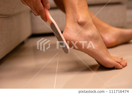 Foot with foot file, Cleansing the heel Foot with foot file, Cleansing the heel 111716474