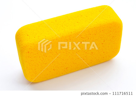 Yellow sponge on white background.  Copy space 111716511