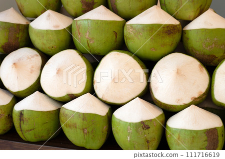 Fresh coconuts in the market 111716619