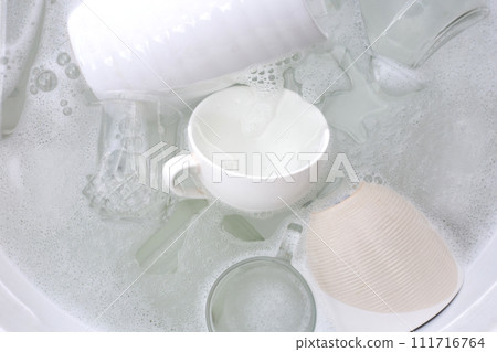 Washing used drinking glasses and cups Washing used drinking glasses and cups 111716764