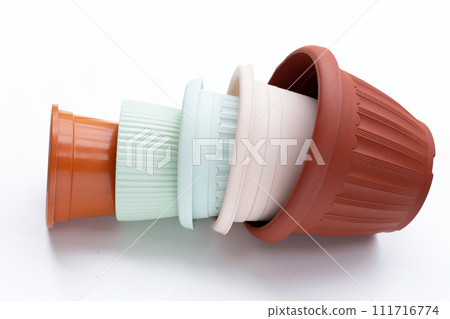 Plastic plant pots, containers on white background. Plastic plant pots, containers on white background. 111716774