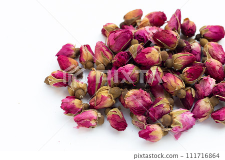 Dried roses for tea on white background. Dried roses for tea on white background. 111716864