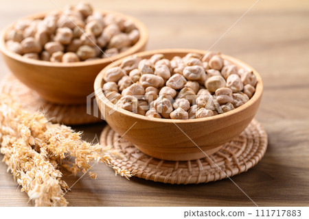 Organic dried chickpea in wooden bowl, Healthy food ingredient 111717883