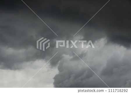 Dramatic dark storm thundercloud rain clouds on black sky background. Dark thunderstorm clouds rainny landscape. Meteorology danger windstorm disaster climate. Dark cloudscape storm disaster gray sky Dramatic dark storm thundercloud rain clouds on black sky background. Dark thunderstorm clouds rainny landscape. Meteorology danger windstorm disaster climate. Dark cloudscape storm disaster gray sky 111718292