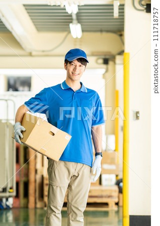 Male driver working in a warehouse 111718757