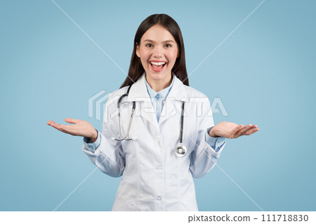 Joyful female doctor gesturing with hands at camera, having video call Joyful female doctor gesturing with hands at camera, having video call 111718830