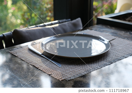 fork, knife and a circle shape plate on table fork, knife and a circle shape plate on table 111718967