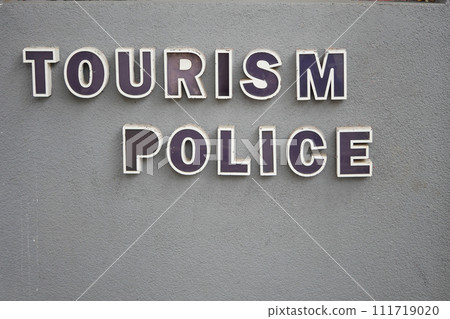 tourism police text on a wall  111719020