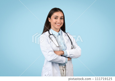 Cheerful doctor with stethoscope posing confidently Cheerful doctor with stethoscope posing confidently 111719125