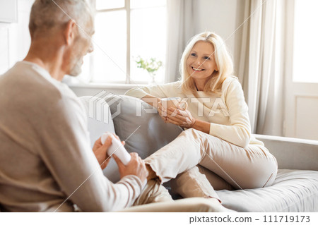 Loving senior husband massaging his tired wife feet Loving senior husband massaging his tired wife feet 111719173