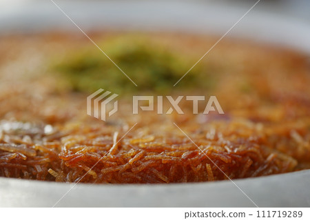 Turkish dessert kunefe, kunafa, kadayif with pistachio  111719289