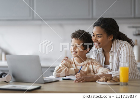 Remote Education. Black Mom And Little Son Using Laptop At Home Together 111719837